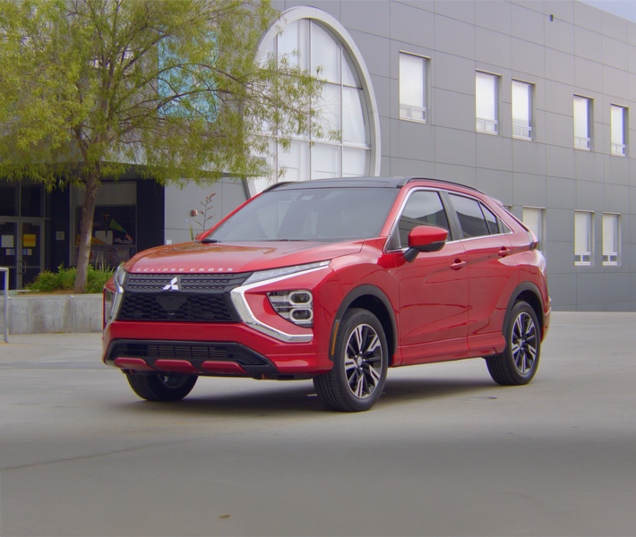 A red 2026 Mitsubishi Eclipse Cross Compact SUV with 1.5L direct-injection engine