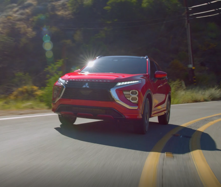 A white 2026 Mitsubishi Eclipse Cross compact SUV with 3 drive modes