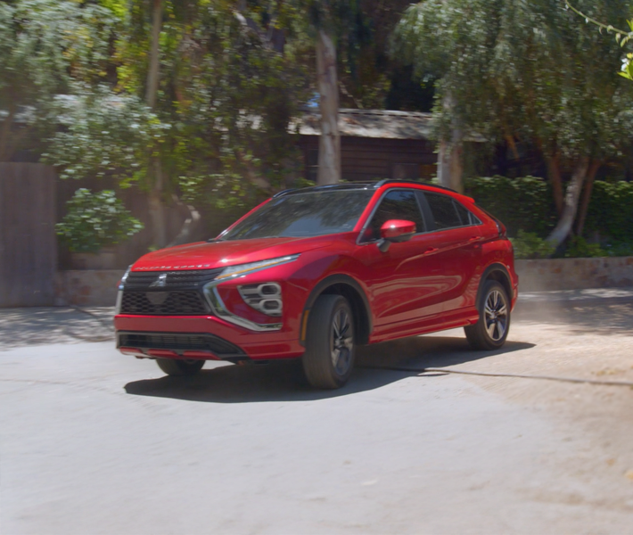 A white 2026 Mitsubishi Eclipse Cross compact SUV with Active Yaw Control (AYC)