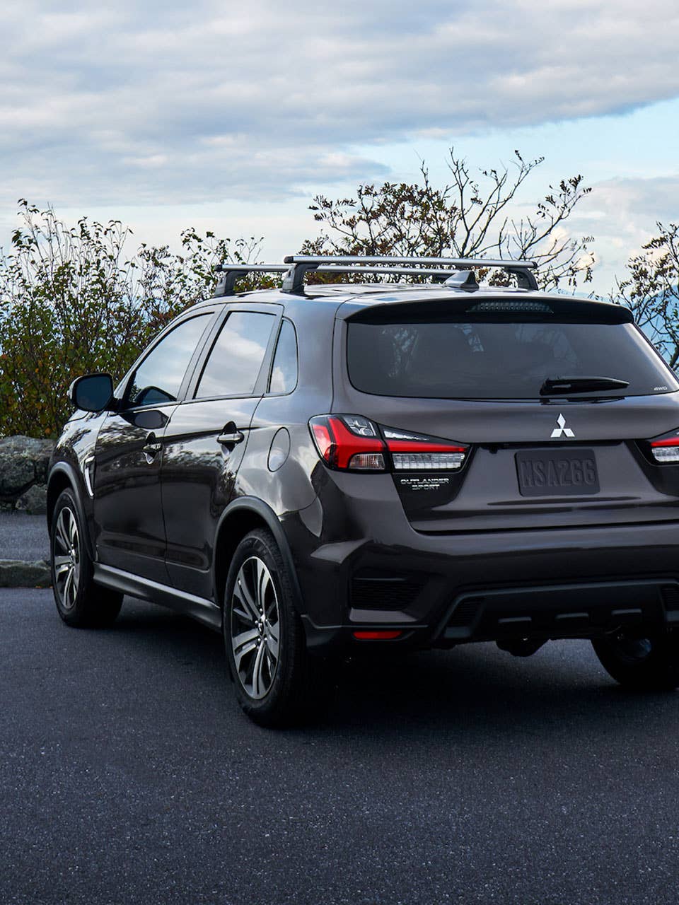 Backview of a brown 2026 Mitsubishi Outlander Sport SUV parked