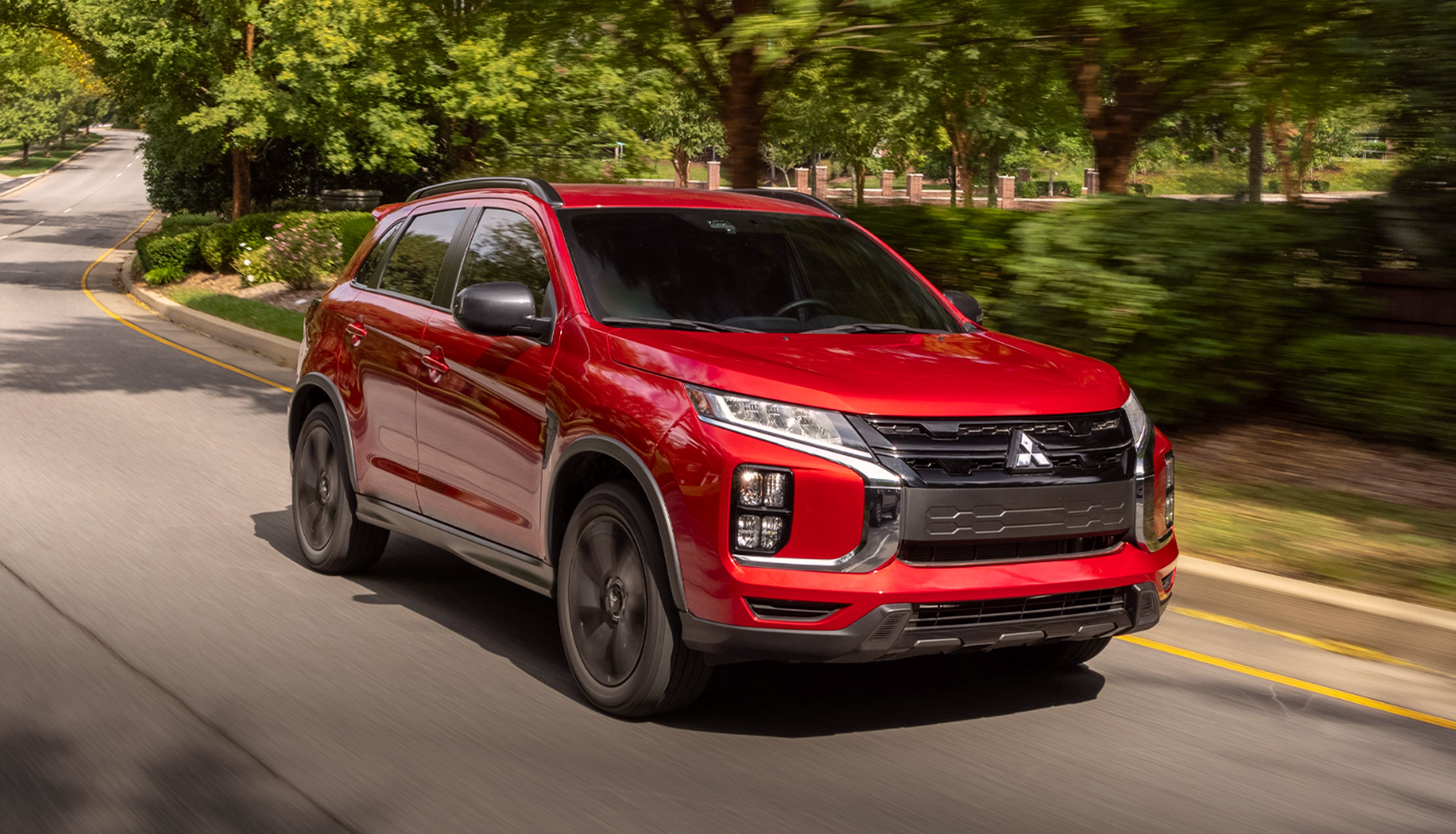 Front angled view of a red 2026 Mitsubishi Outlander Sport SUV
