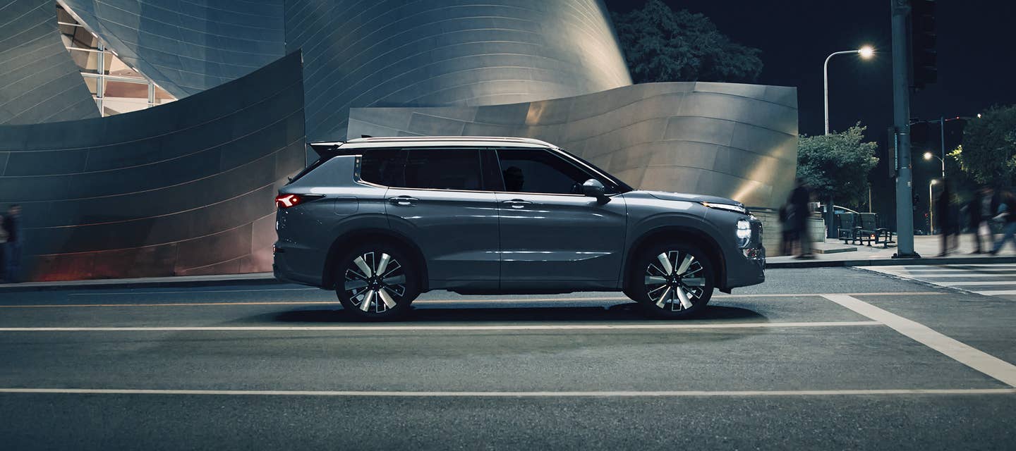 Angled view of a white 2025 Mitsubishi Outlander SUV