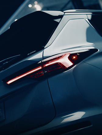 View from behind of a white 2026 Mitsubishi Outlander SUV to show off the LED taillights