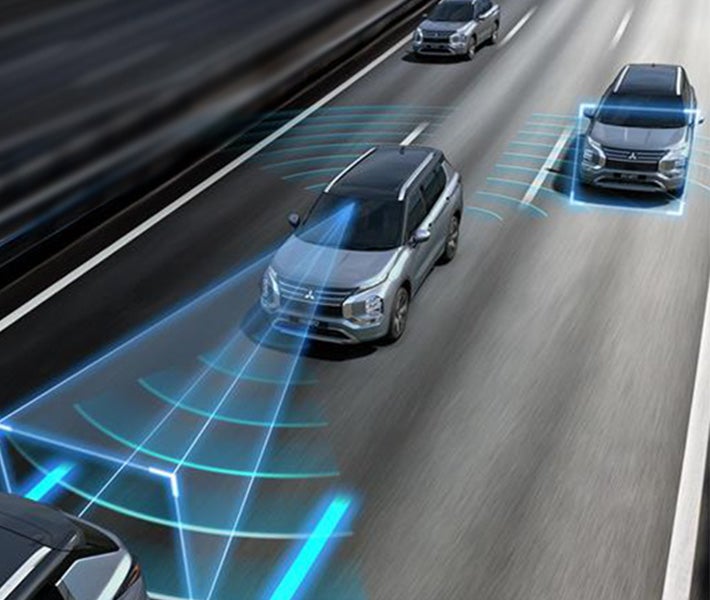 Close up on the traffic jam assist controls on the steering wheel of the 2026 Mitsubishi Outlander SUV