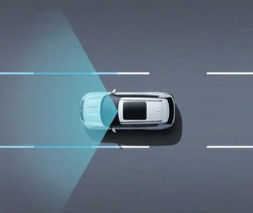 Gráfico que muestra la Mitsubishi Outlander 2026 y su tecnología de centrado de carril vista desde arriba.