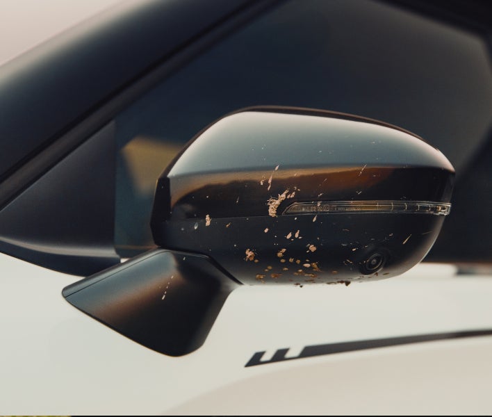 2025 Mitsubishi Outlander Trail Edition SUV with black mirror covers